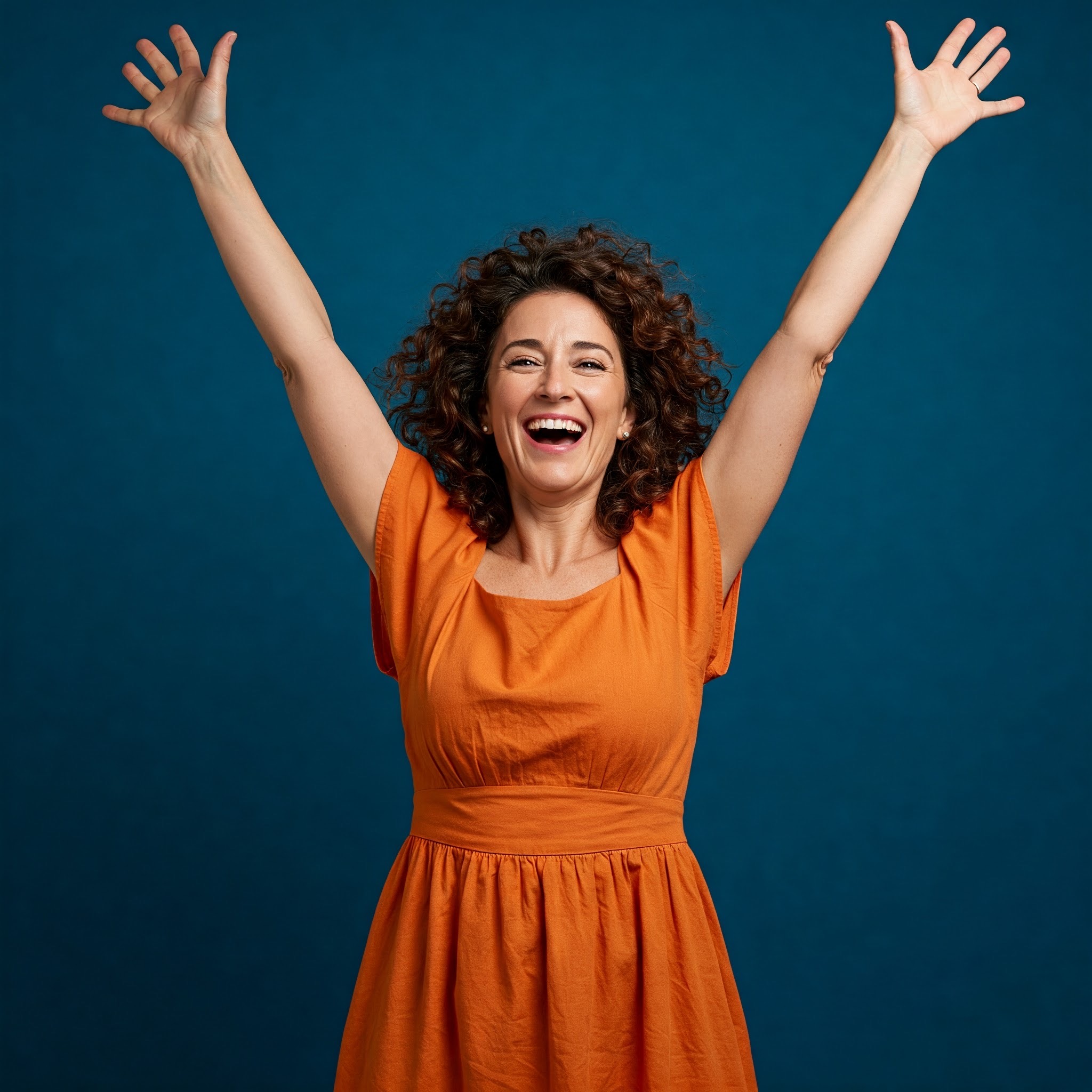 photo of Cheerful Woman with Arms Raised in the air